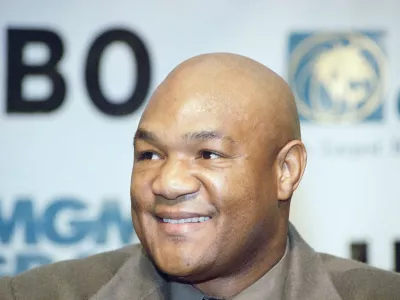 FILE - Former heavyweight champion George Foreman of Houston, reacts during a news conference in Las Vegas, Wednesday, Nov. 2, 1994.(AP Photo/Lennox McLendon, File)