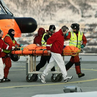Rescue workers bring a survivor from the helicopter to the hospital in Tromso after six skiers were taken by an avalanche near Kaafjord in northern Norway on March 19, 2012. According to initial information to police, six people from a 12-member expedition apparently made up of French nationals were taken by an avalanche at around 2:30 pm (1330 GMT), at an altitude of about 1,000 metres (3,280 feet) on the Sorbmegaisa mountain in the Kaafjord municipality.,Image: 121810320, License: Rights-managed, Restrictions: NORWAY OUT, Model Release: noFoto: Profimedia
