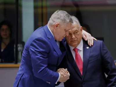 Slovakia's Prime Minister Robert Fico, left, speaks with Hungary's Prime Minister Viktor Orban during a round table meeting at an EU summit in Brussels, Thursday, March 20, 2025. (AP Photo/Omar Havana)