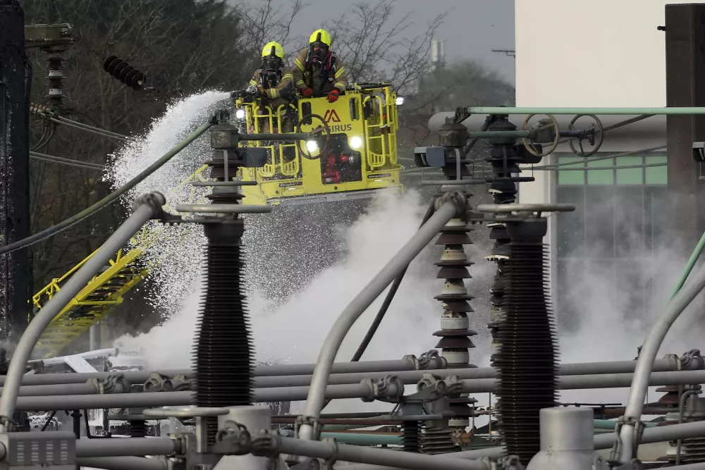 Firefighters extinguish the fire at the North Hyde electrical substation, which caught fire Thursday night and lead to a closure of Heathrow Airport in London, Friday, March 21, 2025.(AP Photo/Kirsty Wigglesworth)