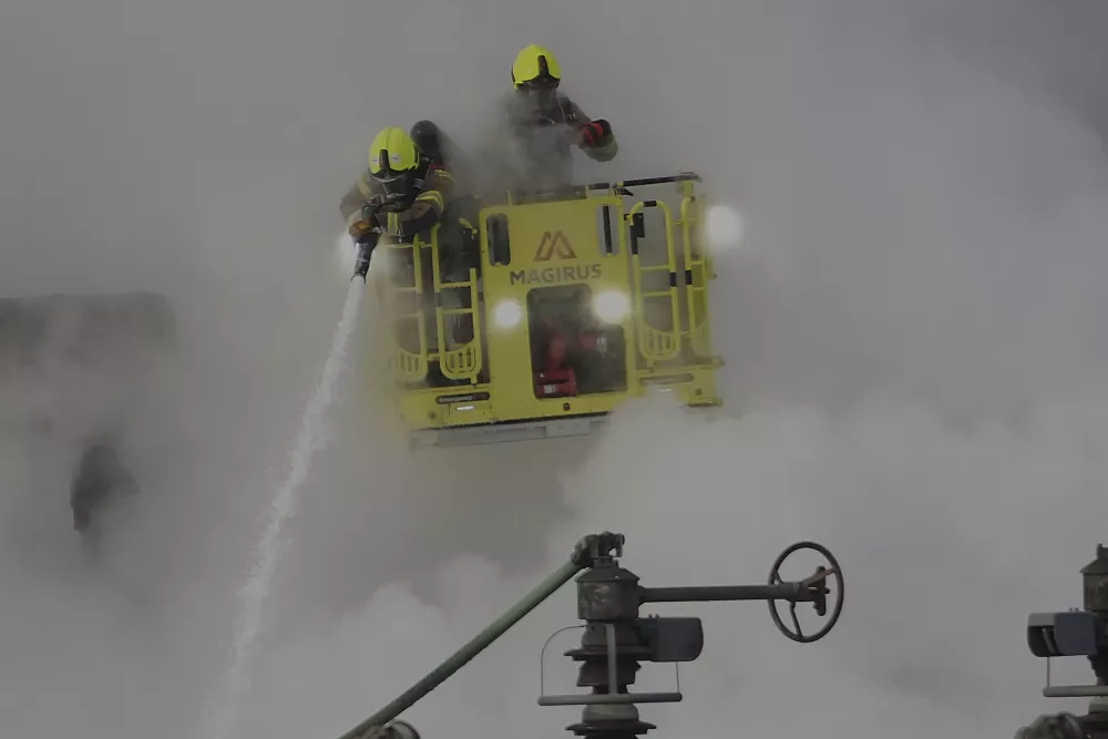 Firefighters extinguish the fire at the North Hyde electrical substation, which caught fire Thursday night and lead to a closure of Heathrow Airport in London, Friday, March 21, 2025.(AP Photo/Kirsty Wigglesworth)