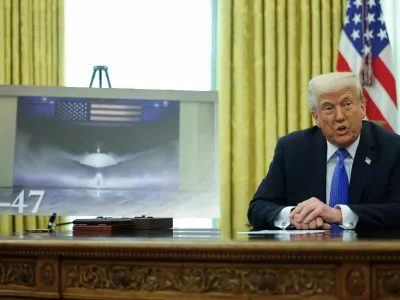 U.S. President Donald Trump delivers remarks, as an image of an F47 is displayed near him, in the Oval Office at the White House, in Washington, D.C., U.S., March 21, 2025. REUTERS/Carlos Barria