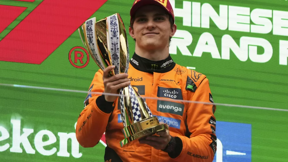 McLaren driver Oscar Piastri of Australia celebrates on the podium after winning the Chinese Formula One Grand Prix race at the Shanghai International Circuit, Shanghai, Sunday, March 23, 2025. (AP Photo/Andy Wong)