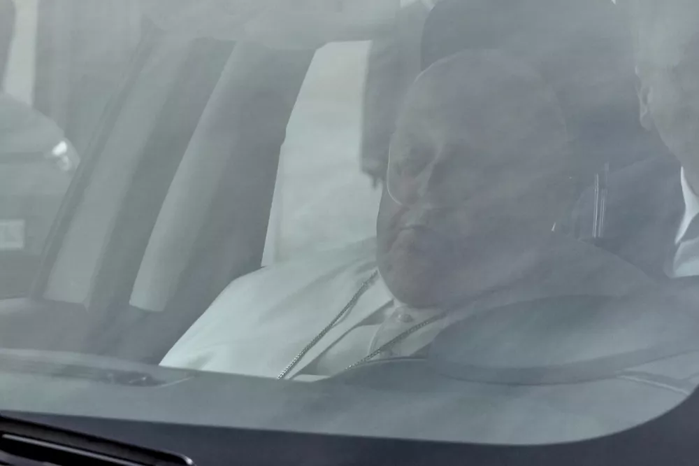 Pope Francis arrives at The Vatican City, Sunday, March 23, 2025, after being released the Agostino Gemelli Polyclinic in Rome after 38 days where he has been treated for bronchitis and bilateral pneumonia since Feb. 14. (AP Photo/Gregorio Borgia)