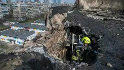 FILE PHOTO: A firefighter works at a site an apartment building hit by a Russian drone strike, amid Russia's attack on Ukraine, in Kyiv, Ukraine March 23, 2025. REUTERS/Vladyslav Musiienko/File Photo