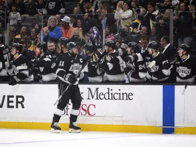 Los Angeles Kings center Anze Kopitar (11) celebrates after his goal during the first period of an NHL hockey game against the Boston Bruins, Sunday, March 23, 2025, in Los Angeles. (AP Photo/William Liang)