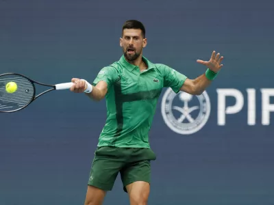 Mar 23, 2025; Miami, FL, USA; Novak Djokovic (SRB) hits a forehand against Camilo Ugo Carabelli (ARG)(not pictured) on day six of the Miami Open at Hard Rock Stadium. Mandatory Credit: Geoff Burke-Imagn Images