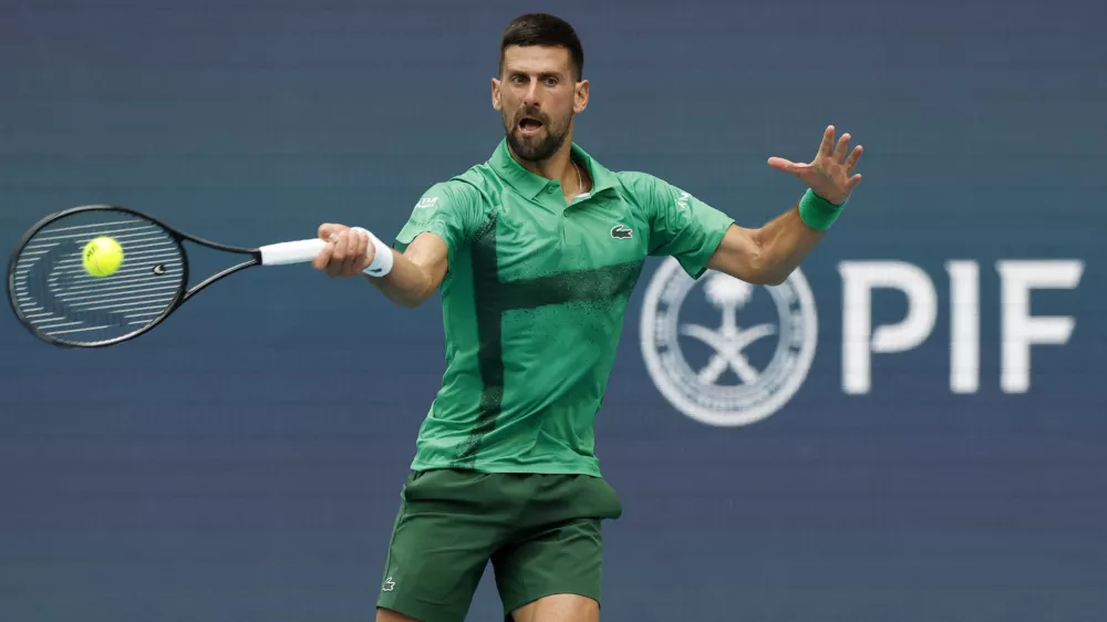 Mar 23, 2025; Miami, FL, USA; Novak Djokovic (SRB) hits a forehand against Camilo Ugo Carabelli (ARG)(not pictured) on day six of the Miami Open at Hard Rock Stadium. Mandatory Credit: Geoff Burke-Imagn Images