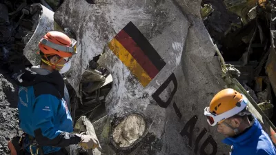 FILE - In this photo taken on March 31, 2015 and provided by the French Interior Ministry, French emergency rescue services work among the debris of the Germanwings passenger jet at the crash site near Seyne-les-Alpes, France. (Yves Malenfer/Ministere de l'Interieur, File)