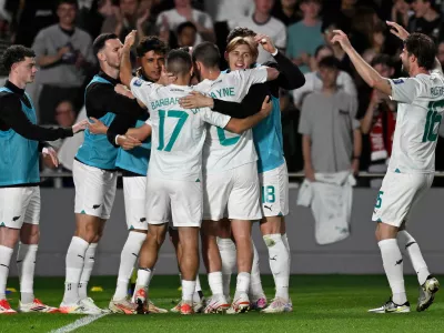 24 March 2025, New Zealand, Auckland: New Zealand's Elijah Just celebrates scoring his side's third goal with teammates during the FIFA World Cup 2026 Oceania Qualifier match against New Caledonia at Eden Park in Auckland. Photo: Andrew Cornaga/AAP/dpa
