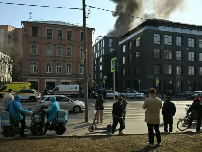 8886696 24.03.2025 People gather near the Roza Rossa residential complex where a fire broke out, on the Zubovskaya Street in Moscow, Russia. The roof of a five-story building burst into flames on an area of about 100 square meters.,Image: 978925615, License: Rights-managed, Restrictions: Editors' note: THIS IMAGE IS PROVIDED BY RUSSIAN STATE-OWNED AGENCY SPUTNIK., Model Release: noFoto: Profimedia