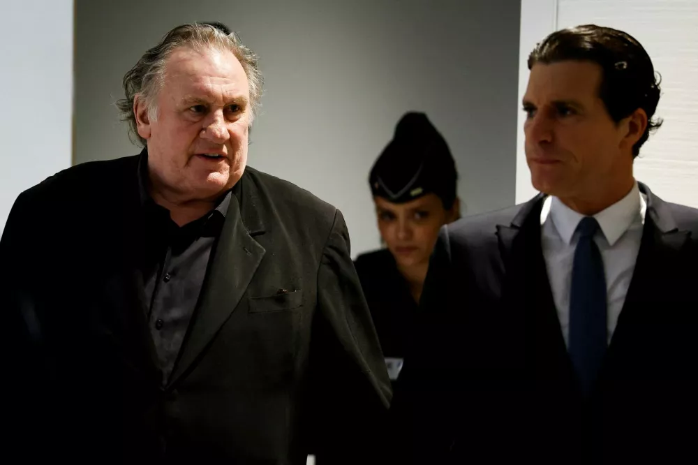French actor Gerard Depardieu arrives on the day of his trial for two sexual assaults allegedly committed on the set of the film "Les Volets Verts", at the courthouse in Paris, France, March 24, 2025. REUTERS/Stephanie Lecocq