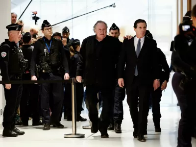 French actor Gerard Depardieu walks with his lawyer Jeremie Assous, on the day of Depardieu's trial for two sexual assaults allegedly committed on the set of the film "Les Volets Verts", at the courthouse in Paris, France, March 24, 2025. REUTERS/Benoit Tessier