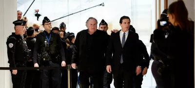 French actor Gerard Depardieu walks with his lawyer Jeremie Assous, on the day of Depardieu's trial for two sexual assaults allegedly committed on the set of the film "Les Volets Verts", at the courthouse in Paris, France, March 24, 2025. REUTERS/Benoit Tessier