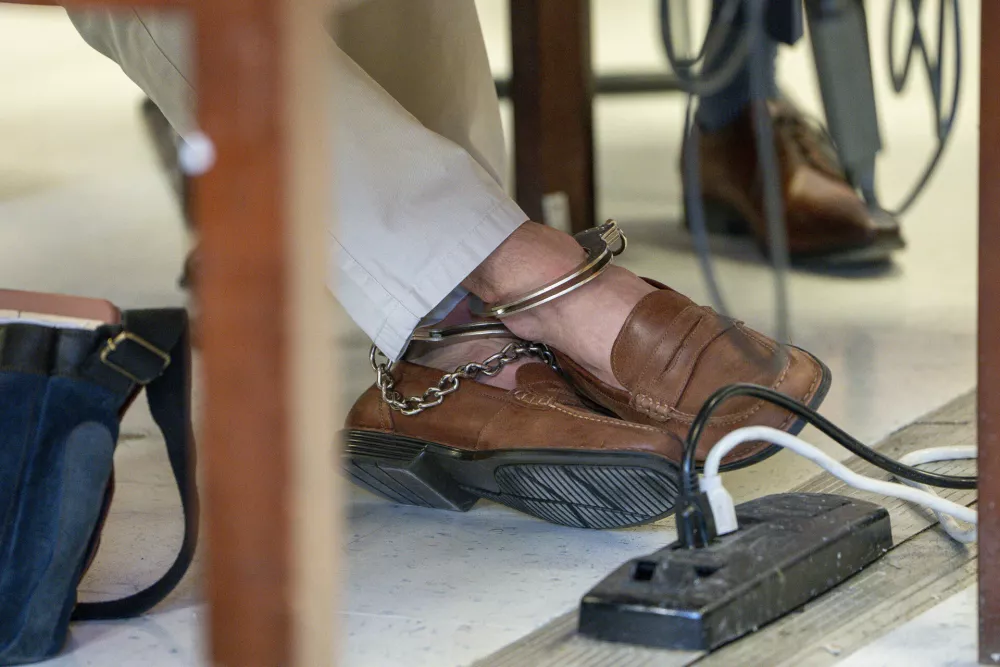 FILE - Luigi Mangione, accused of fatally shooting the UnitedHealthcare CEO Brian Thompson in New York City and leading authorities on a five-day search is scheduled, wear's ankle cuff during a court hearing, Friday, Feb. 21, 2025, in New York. (Steven Hirsch/New York Post via AP, Pool, File)