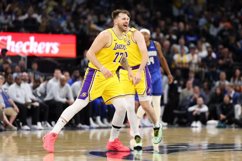 Mar 24, 2025; Orlando, Florida, USA; Los Angeles Lakers guard Luka Doncic (77) reacts after a basket against the Orlando Magic in the first quarter at Kia Center. Mandatory Credit: Nathan Ray Seebeck-Imagn Images