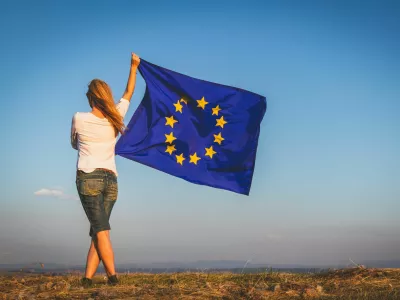 EU flag in female hands.