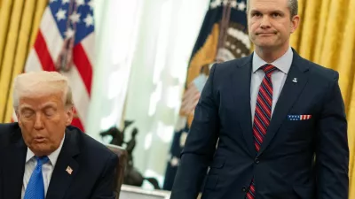 U.S. Defense Secretary Pete Hegseth stands by U.S. President Donald Trump, in the Oval Office at the White House, in Washington, D.C., U.S., March 21, 2025. REUTERS/Carlos Barria