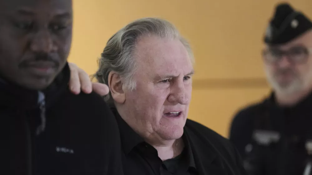 Actor Gerard Depardieu returns to the courtroom after a break for his trial for the alleged sexual assaults of two women on a film set in 2021, Tuesday, March 25, 2025 in Paris. (AP Photo/Aurelien Morissard)
