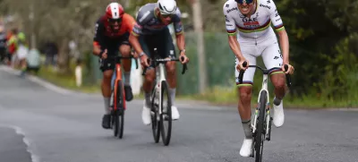 From left, second-placed Filippo Ganna, winner Mathieu van der Poel and third-placed Tadej Pogacar compete in the men's elite race of the Milano-Sanremo one day cycling race (289 km) from Pavia, in Sanremo, Italy, Saturday March 22, 2025. (Gian Mattia D'Alberto/LaPresse via AP)