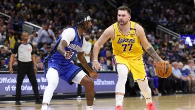 Mar 24, 2025; Orlando, Florida, USA; Los Angeles Lakers guard Luka Doncic (77) drives to the basket against the Orlando Magic in the second quarter at Kia Center. Mandatory Credit: Nathan Ray Seebeck-Imagn Images