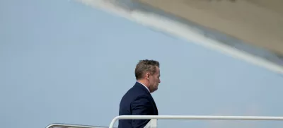 U.S. National Security Advisor Mike Waltz boards Air Force One as U.S. President Donald Trump departs for Florida, at Joint Base Andrews, Maryland, U.S., April 3, 2025. REUTERS/Kent Nishimura