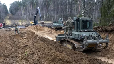 Recovery efforts continue for four missing U.S. soldiers near the spot where their Hercules armored vehicle was found submerged at a training range in Pabrade, north of the capital Vilnius, Lithuania on Thursday, March 27, 2025. (AP Photo/Mindaugas Kulbis)