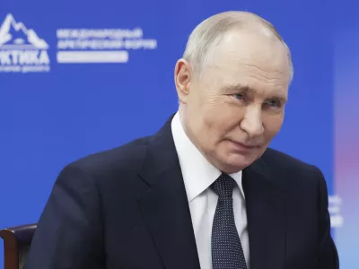 Russian President Vladimir Putin speaks with the governor of Murmansk region Andrey Chibis on the sidelines of the International Arctic Forum in Murmansk, Russia, Thursday, March 27, 2025. (Gavriil Grigorov, Sputnik, Kremlin Pool Photo via AP)