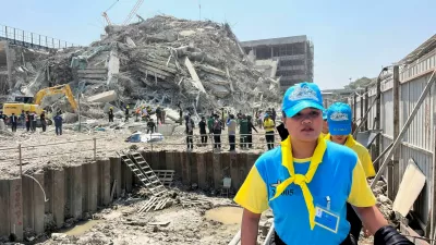 Thai King's volunteers work near the site of a collapsed building after a strong earthquake struck central Myanmar on Friday, earthquake monitoring services said, which affected Bangkok as well with hundreds of people pouring out of buildings in the Thai capital in panic after the tremors, in Bangkok, Thailand, March 28, 2025. REUTERS/Ann Wang   TPX IMAGES OF THE DAY