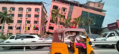 Motorists ride past a damaged building after a strong earthquake struck central Myanmar, in Mandalay, Myanmar, March 28, 2025. REUTERS/Stringer   TPX IMAGES OF THE DAY