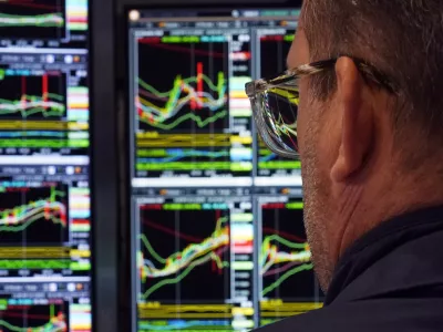 A specialist works at his post on the floor of the New York Stock Exchange, Wednesday, March 12, 2025. (AP Photo/Richard Drew)