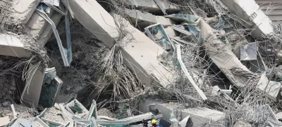 Rescue personnel work at the site of a building that collapsed, following a strong earthquake, in Bangkok, Thailand, March 29, 2025. REUTERS/Chalinee Thirasupa