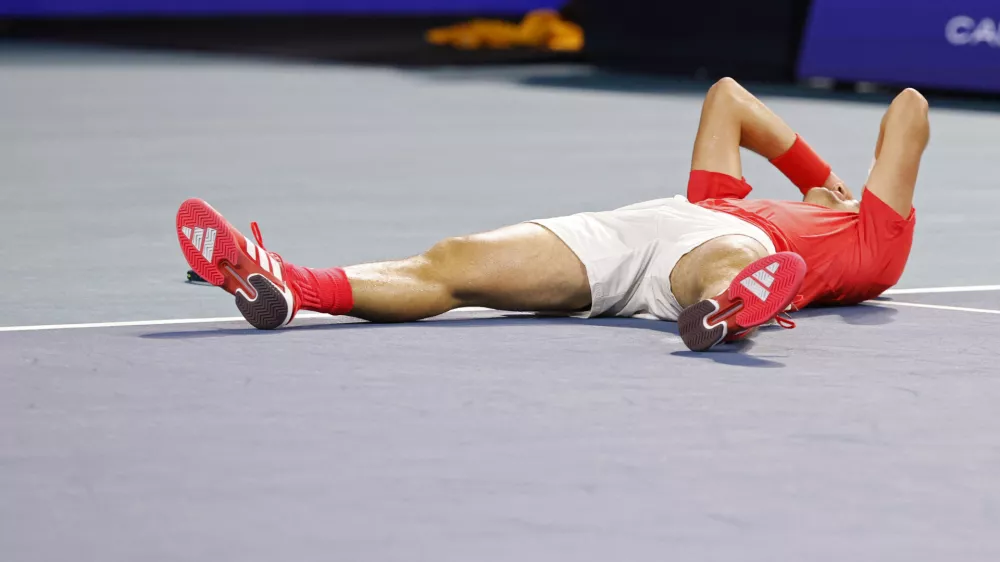 Mar 30, 2025; Miami, FL, USA; Jakub Mensik (CZE) celebrates after match point against Novak Djokovic (SRB)(not pictured) in the men's singles championship of the Miami Open at Hard Rock Stadium. Mandatory Credit: Geoff Burke-Imagn Images