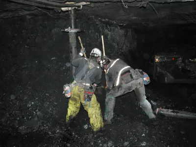 ** CORRECTS WORDING TO REFLECT THAT WORKERS ARE IN THE MINE PASSAGEWAY, NOT MAIN PASSAGEWAY ** In this photo released by Utah American Energy Inc., unidentified miners clear the mine passageway of the Crandall Canyon Mine in an effort to reach six trapped miners inside the mine, northwest of Huntington, Utah, Tuesday, Aug. 14, 2007. Crews are drilling a third hole in the more than weeklong search for six missing coal miners, and may drill a fourth if this attempt turns up nothing. (AP Photo/Utah America Energy Inc.)  **NO SALES**