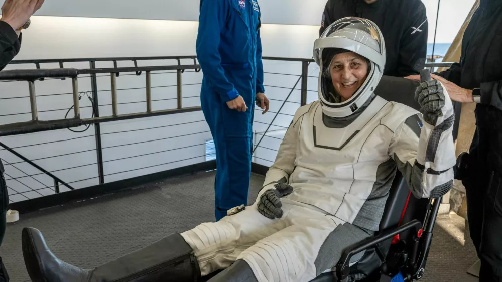 NASA astronaut Suni Williams is helped out of a SpaceX Dragon spacecraft onboard the SpaceX recovery ship MEGAN after she, NASA astronaut Nick Hague, and Butch Wilmore, and Roscosmos cosmonaut Aleksandr Gorbunov landed in the water off the coast of Tallahassee, Florida, Tuesday, March 18, 2025. NASA/Keegan Barber/ Handout via REUTERS