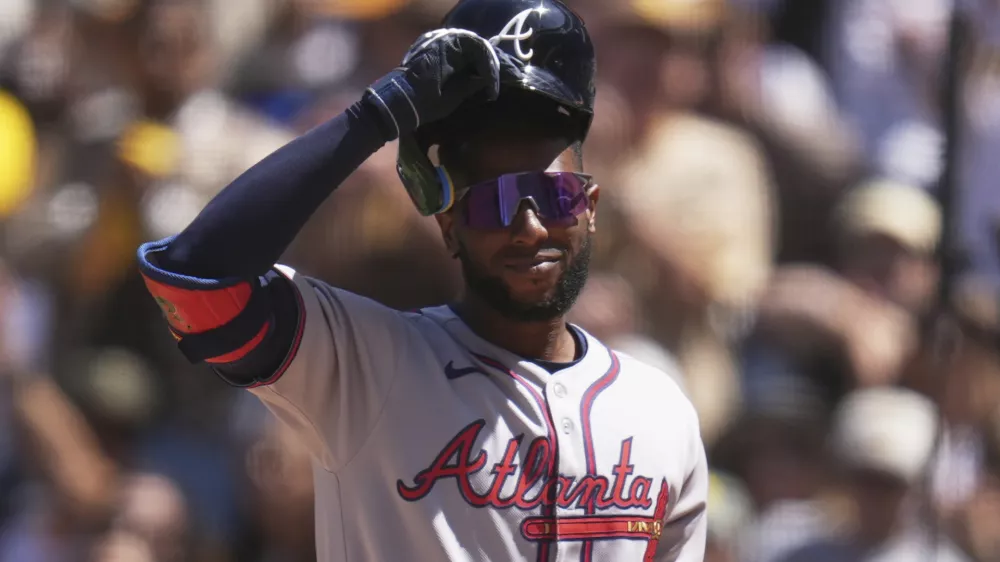 FILE - Atlanta Braves' Jurickson Profar acknowledges the crowd as he walks up to bat during the first inning of an opening-day baseball game against his former team, the San Diego Padres, March 27, 2025, in San Diego. (AP Photo/Gregory Bull, File)
