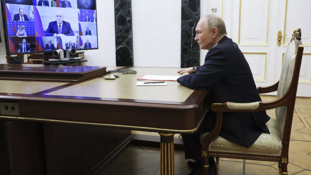 Russian President Vladimir Putin chairs the Security Council meeting via videoconference at the Kremlin in Moscow, Russia, Tuesday, April 1, 2025. (Vyacheslav Prokofyev, Sputnik, Kremlin Pool Photo via AP)