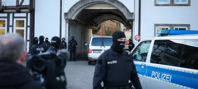 A transport vehicle carrying Daniela Klette, accused of being one of the last surviving members of the Red Army Faction group, who was arrested after decades on the run for armed robbery and attempted murder, is escorted by police cars as it arrives at the compound of the court builing on April 1, 2025 in Celle, northern Germany, as her trial continues.  RONNY HARTMANN/Pool via REUTERS