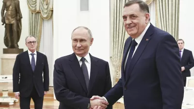 Russian President Vladimir Putin, center, and Bosnian Serb President Milorad Dodik shake hands during their meeting at the Kremlin in Moscow, Russia, Tuesday, April 1, 2025. (Mikhail Tereshchenko, Sputnik, Kremlin Pool Photo via AP)