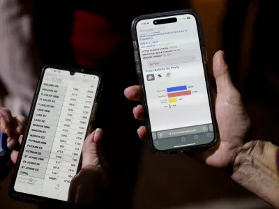 Supporters of Randy Fine, Republican nominee for 2025 Florida's 6th congressional district special election, use their phones to check election results at a watch party, as Florida holds a special election for a U.S. House of Representatives seat vacated by National Security Adviser Michael Waltz, in Ormond Beach, Florida, U.S. April 1, 2025. REUTERS/Octavio Jones