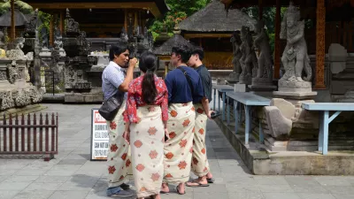 BALI, INDONESIA- 14 FEB, 2019: Group of tourists visit Tirta Empul Temple Bali,Indonesia. Tirta Empul Holy Water Temple is a very popular destination in Bali,Indonesia