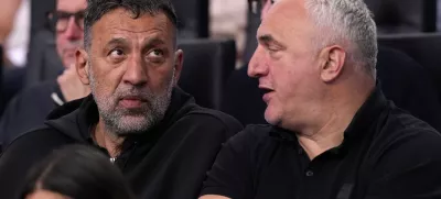 Former Los Angeles Laker Vlade Divac, left, sits with Sasa Doncic, father of Los Angeles Lakers' Luka Doncic, during the second half of an NBA basketball game between the Lakers and the Golden State Warriors Thursday, April 3, 2025, in Los Angeles. (AP Photo/Mark J. Terrill)