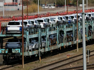 FILE PHOTO: Cars of the Volkswagen Group intended for export to the United States and the United Kingdom arrive on train carriages in Emden, Germany, April 2, 2025. REUTERS/Wolfgang Rattay/File Photo
