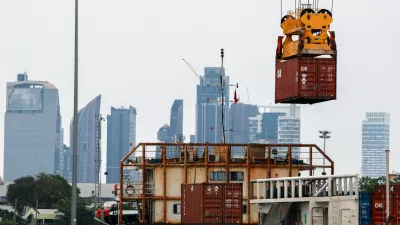 A container is loaded onto a cargo ship while docked at the port of Bangkok, in Bangkok, Thailand, April 3, 2025. Thailand, with a tariff rate of 37 per cent imposed by U.S. President Donald Trump, is one of the six countries in the Southeast Asian region slapped with much higher-than-expected traffis by the U.S. REUTERS/Athit Perawongmetha