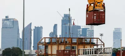 A container is loaded onto a cargo ship while docked at the port of Bangkok, in Bangkok, Thailand, April 3, 2025. Thailand, with a tariff rate of 37 per cent imposed by U.S. President Donald Trump, is one of the six countries in the Southeast Asian region slapped with much higher-than-expected traffis by the U.S. REUTERS/Athit Perawongmetha