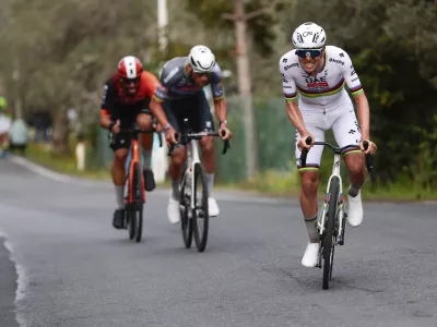 From left, second-placed Filippo Ganna, winner Mathieu van der Poel and third-placed Tadej Pogacar compete in the men's elite race of the Milano-Sanremo one day cycling race (289 km) from Pavia, in Sanremo, Italy, Saturday March 22, 2025. (Gian Mattia D'Alberto/LaPresse via AP)