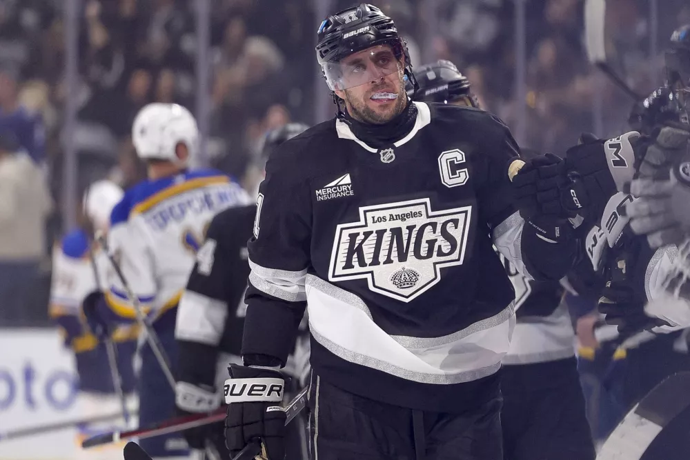 Mar 8, 2025; Los Angeles, California, USA; Los Angeles Kings center Anze Kopitar (11) celebrates with the bench after scoring against the St. Louis Blues during the first period at Crypto.com Arena. Mandatory Credit: Ryan Sun-Imagn Images
