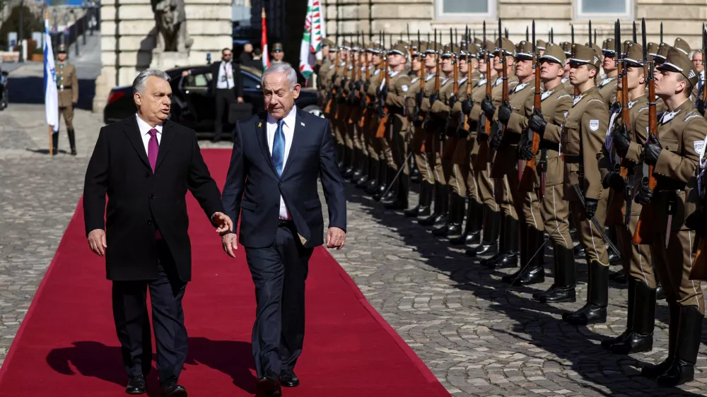 Hungarian Prime Minister Viktor Orban and Israeli Prime Minister Benjamin Netanyahu walk on the red carpet during a welcoming ceremony at the Lion's Courtyard in Budapest, Hungary, April 3, 2025. REUTERS/Bernadett Szabo