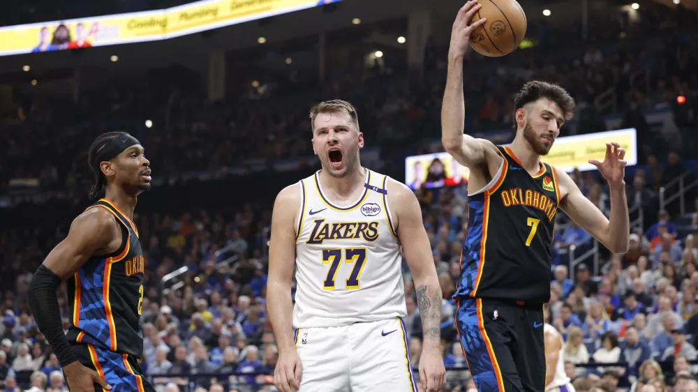 Apr 6, 2025; Oklahoma City, Oklahoma, USA; Los Angeles Lakers guard Luka Doncic (77) yells after scoring against the Oklahoma City Thunder during the second quarter at Paycom Center. Mandatory Credit: Alonzo Adams-Imagn Images