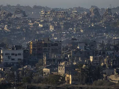 FILE - Destroyed buildings are seen inside the Gaza Strip from southern Israel, Jan. 13, 2025. (AP Photo/Ariel Schalit, File)
